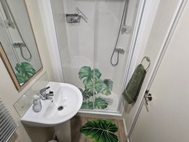 A bathroom with a sink and shower at Homeslea 33 Millennium Gardens Morpeth