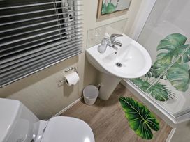 A bathroom with sink and toilet at Homeslea 33 Millennium Gardens in Morpeth