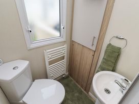 A bathroom with a sink and toilet at Homeslea 33 Millennium Gardens Morpeth