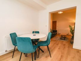A dining room with a table and chairs at Holmwood