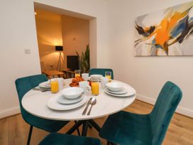 A dining room with a table set for breakfast at Holmwood