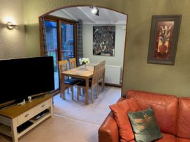 A dining room with a table and chairs at The Hermitage in Penrith