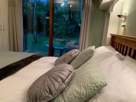 A bedroom with pillows on a bed at The Hermitage in Penrith