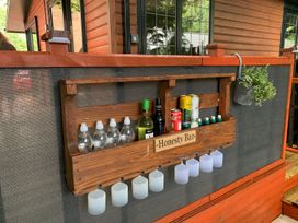 An honesty bar shelf with drinks in an outdoor area at The Hermitage in Penrith