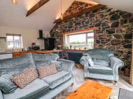 A living room with a sofa and armchairs at The Stable in Dublin
