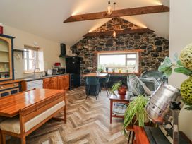 A kitchen with a dining table and chairs at The Stable in Dublin