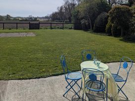A garden with a table and chairs at The Stable, Swords, County Dublin