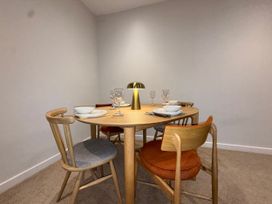 A dining room with a table set for dinner at Amber Rose in Berwick-upon-Tweed
