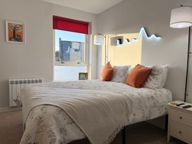 A bedroom with a bed and window at Amber Rose in Berwick-upon-Tweed