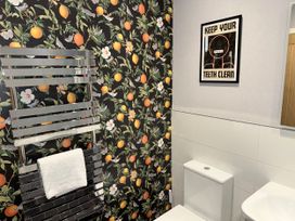 A bathroom featuring a towel rail and a toilet at Amber Rose Berwick-upon-Tweed