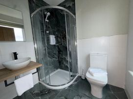 A bathroom with a shower and toilet at Amber Rose in Berwick-upon-Tweed