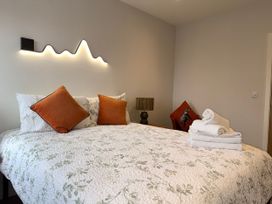 A bedroom with a bed and pillows at Amber Rose in Berwick-upon-Tweed