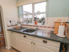 A kitchen with a sink and utensils at Sandy Cove in Chathill