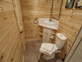 A bathroom with a toilet and sink at Mardi Gras in Wisbech