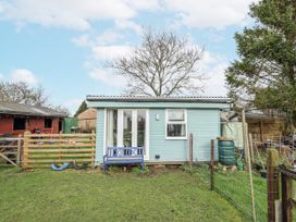 A garden with a shed and bench at Mardi Gras in Wisbech
