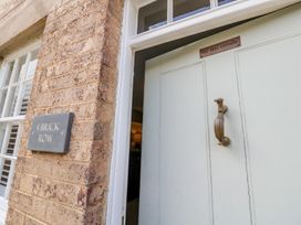 An entryway with a door and house number at Tea Tree Cottage in Chipping Campden