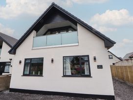 A house with windows and a balcony at Mike’s Place in Rhyl