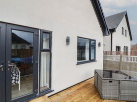 An outdoor area with a door and window at Mike’s Place in Rhyl