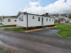 A mobile home with steps on a patio at Valley 36 in Kingsbridge