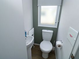 A bathroom with a toilet and sink at Valley 36 in Kingsbridge