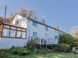 A house with a deck and conservatory at 2 Oak Tree Cottages Marshwood Nr. Hawkchurch