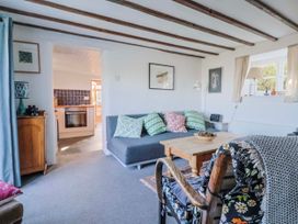 A living room with a sofa and coffee table at 2 Oak Tree Cottages, Marshwood Nr. Hawkchurch