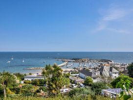 A view of a marina with boats and houses at 2 Oak Tree Cottages in Marshwood Nr. Hawkchurch