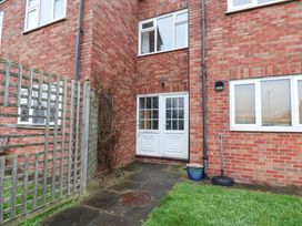An outdoor entrance with a door and garden area at Flat 1, 40 Hinderwell Lane