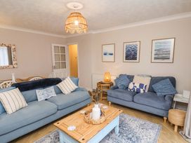 A living room with sofas and a coffee table at Flat 1, 40 Hinderwell Lane
