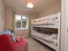 A bedroom with a bunk bed and a bean bag at Flat 1, 40 Hinderwell Lane
