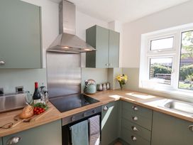 A kitchen with a wooden countertop and stove at Seashells at Runswick Lodge Runswick Bay