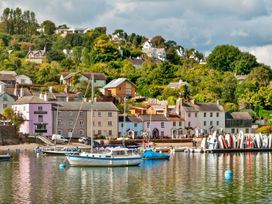 A waterfront view with houses and boats at Capton Snug Dartmouth
