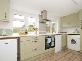 A kitchen with appliances and countertop at Casa Mia in Porthpean near St Austell