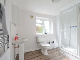 A bathroom featuring a shower and a sink at Casa Mia in Porthpean near St Austell