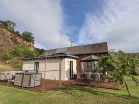A house with decking and furniture at Summerset Lodge in Bamburgh