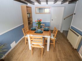 A dining room with a table set for meals at Beacon House Marloes near Little Haven
