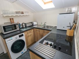 A kitchen with appliances and fixtures at Beacon House Marloes near Little Haven