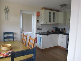 A kitchen with cabinets and appliances at Hope Cove near Kingsbridge