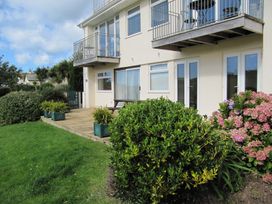 A building with a balcony and garden area at Hope Cove near Kingsbridge
