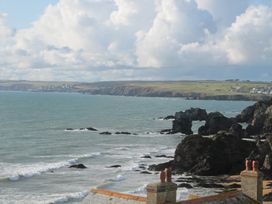 A coastal view with rocks and waves at Hope Cove near Kingsbridge