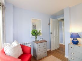 A living room with a sofa and drawer unit at Quay Sands, Hope Cove