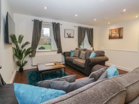 A living room with sofa and coffee table at 6 Hallin Fell in Penrith