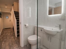 A bathroom with a toilet and sink at 6 Hallin Fell Penrith