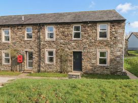 A stone house with a front door and windows at 6 Hallin Fell Penrith