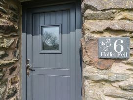 A front door of a property with stone wall at 6 Hallin Fell Penrith