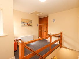 A hallway with a radiator and storage cabinet at Macmathuna in Kilrush, County Clare