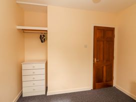 A bedroom with a closet and drawer unit at Macmathuna, Kilrush, County Clare