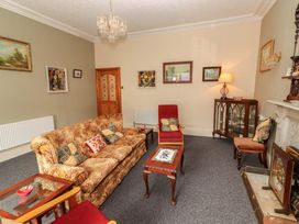 A living room with furniture and decor at Macmathuna, Kilrush, County Clare