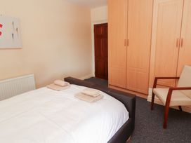 A bedroom with a bed and towels on it at Macmathuna in Kilrush, County Clare