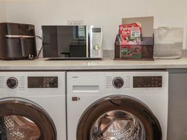 A laundry room with a washer and dryer at Creek Lodge in Chacewater